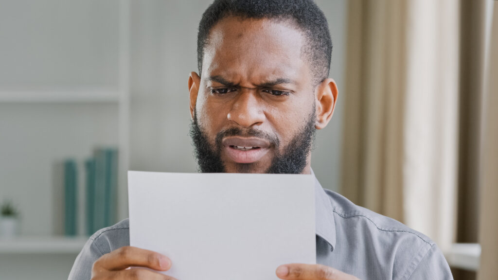 man reading disability denial